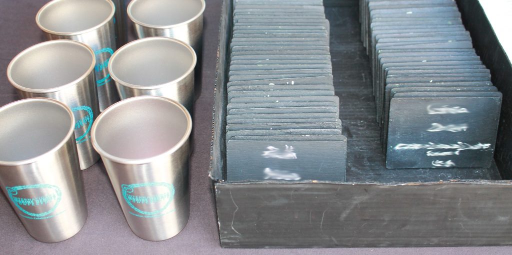 Reusable steel cups and wooden name tags.